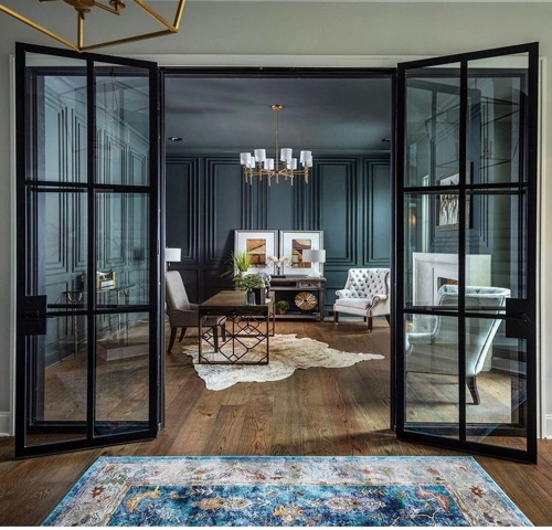 black-framed glass French doors leading into a moody, modern home office.
